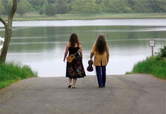 Julie and Denya walking together photo from their Comfort and Joy rack card